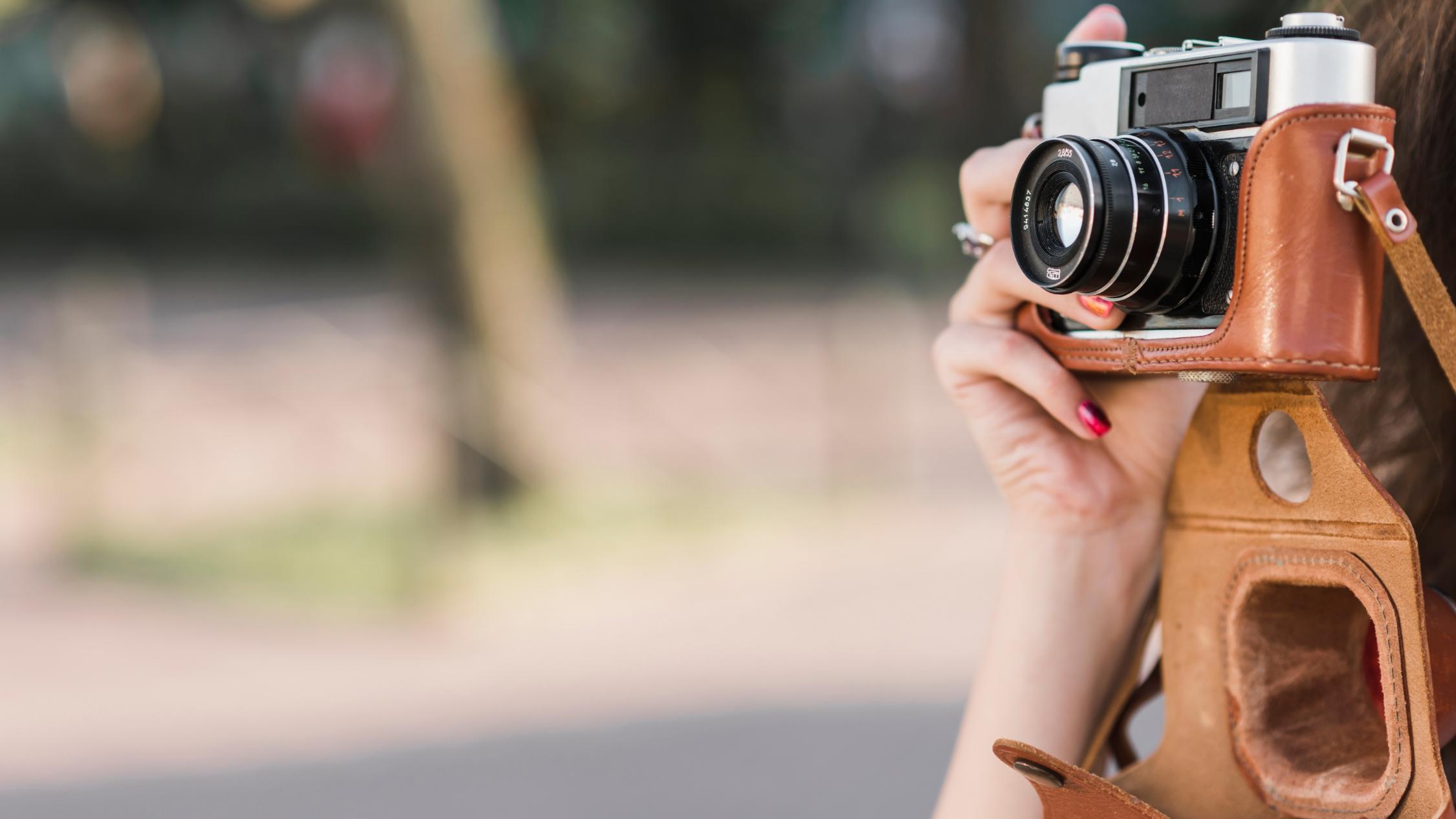 hand-taking-picture-old-camera