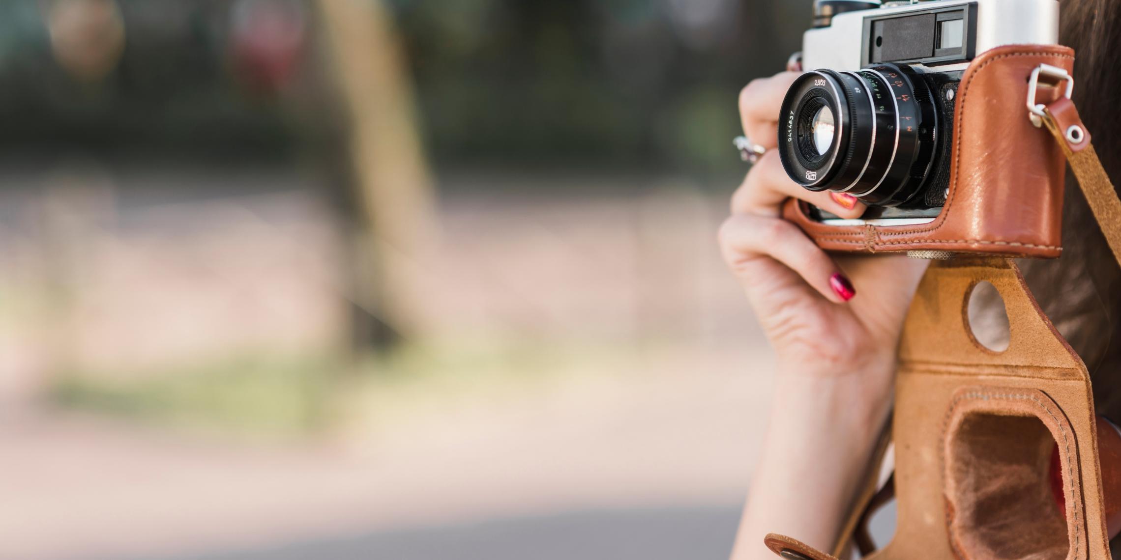 hand-taking-picture-old-camera